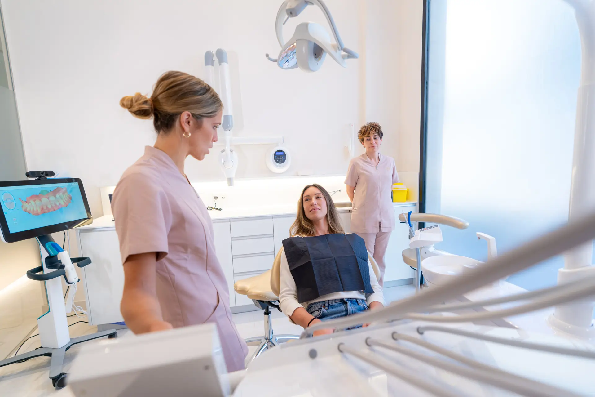 Dentist and assistant with patient