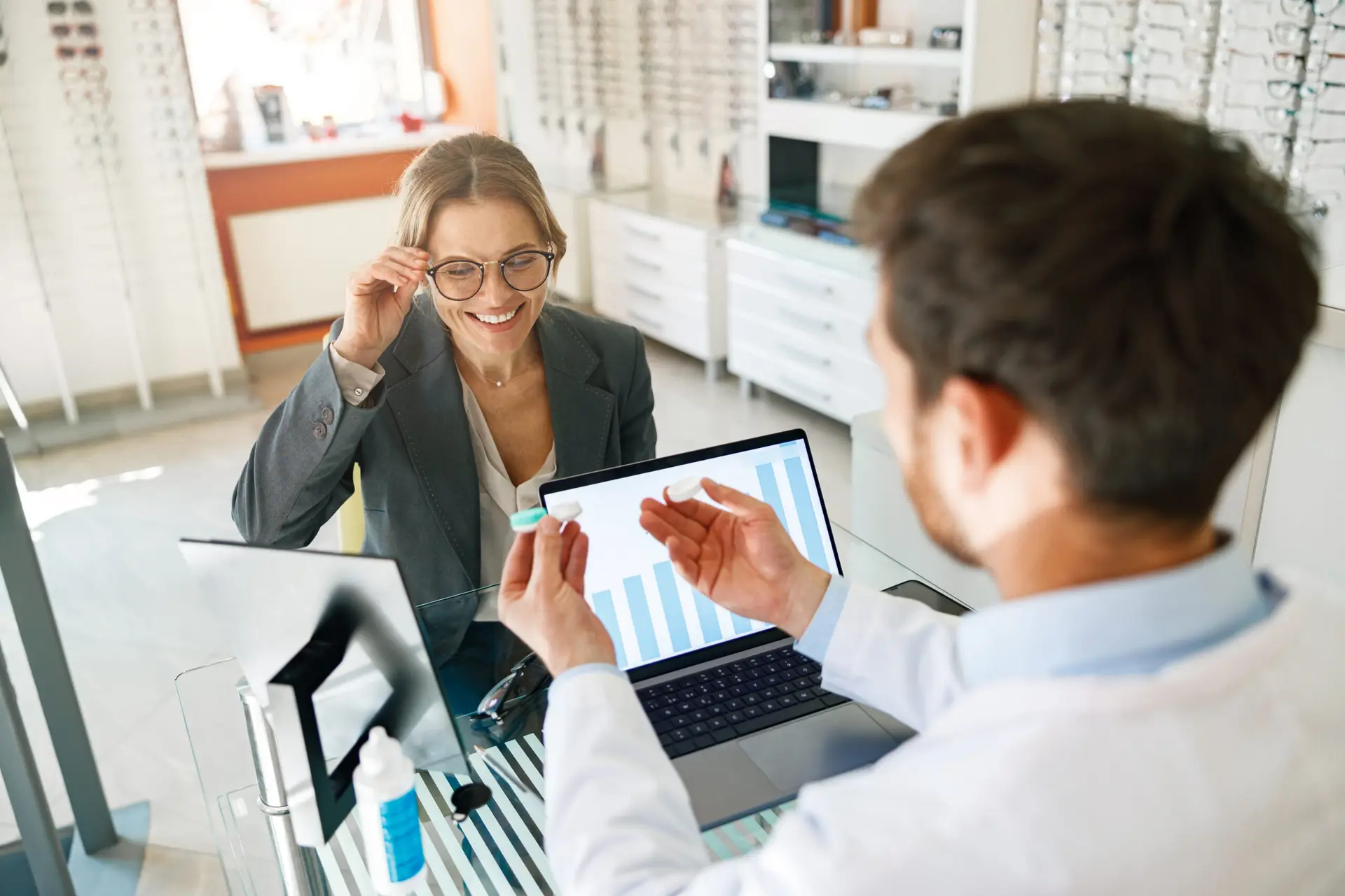 Ophthalmologist offering lenses