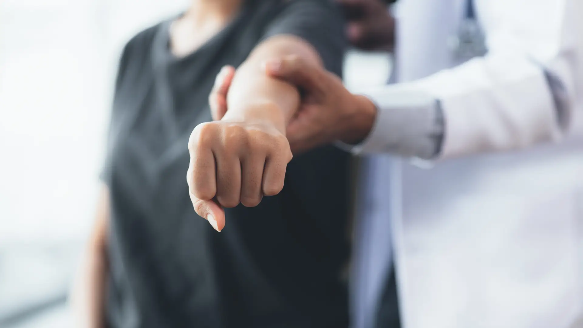 Physiotherapist adjusting arm